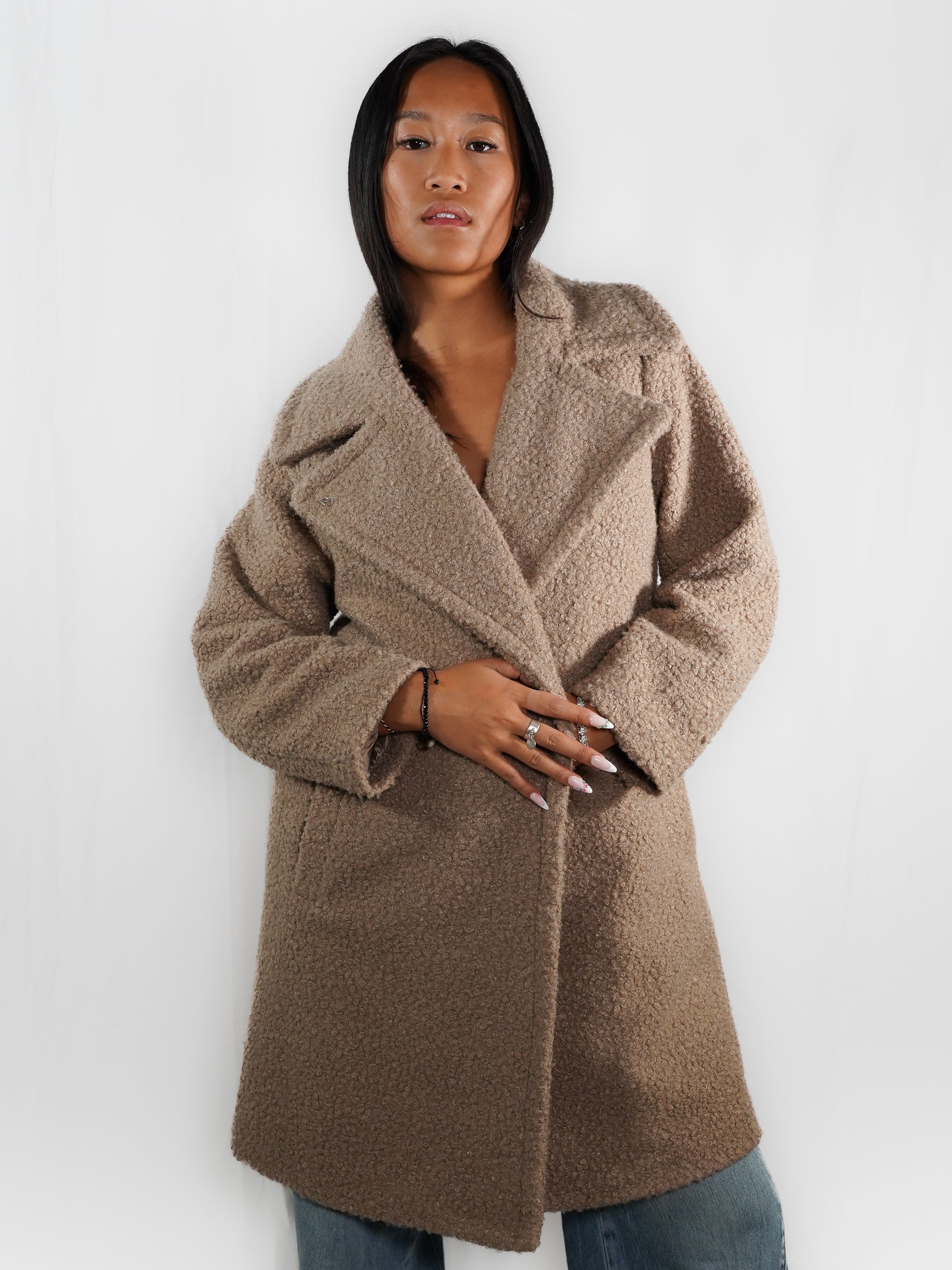 Le manteau long imitation peau de mouton