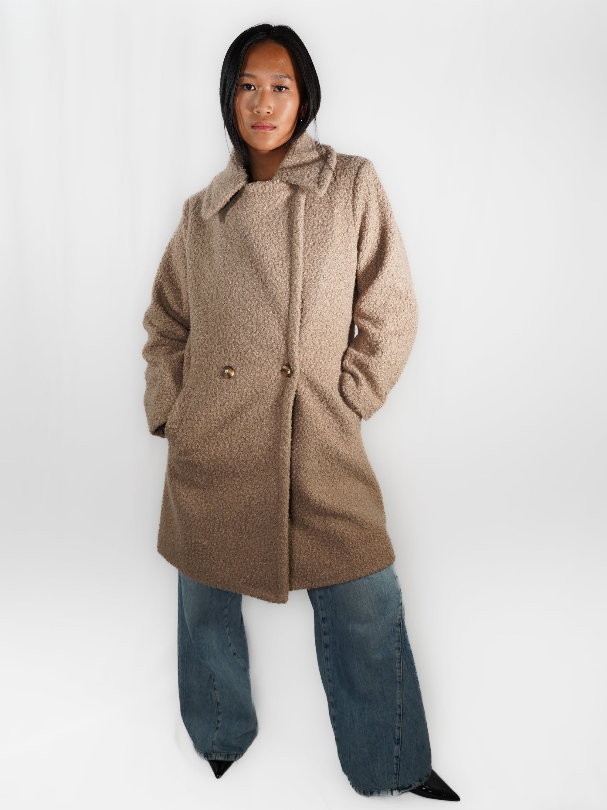 Le manteau long imitation peau de mouton
