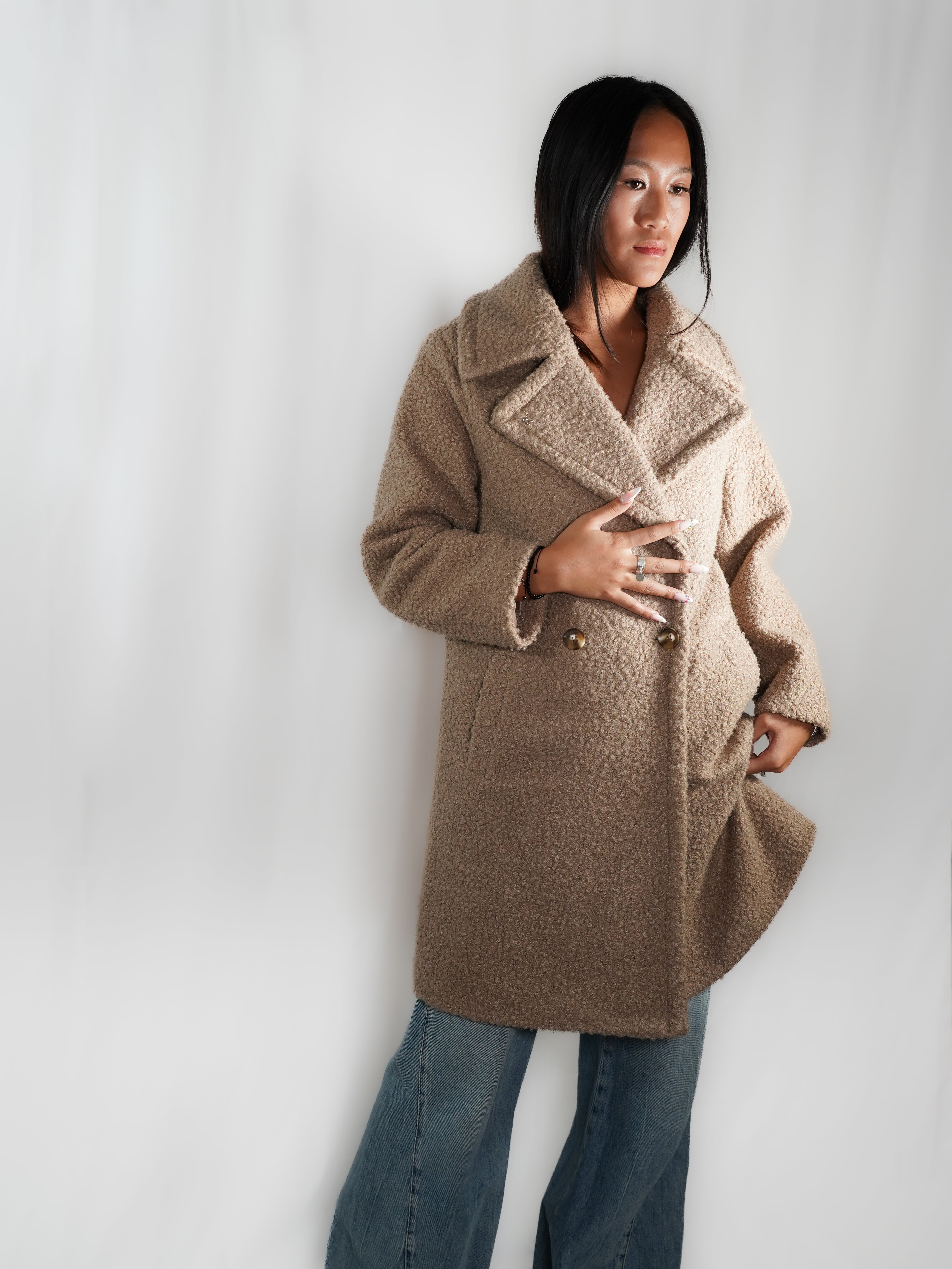 Le manteau long imitation peau de mouton